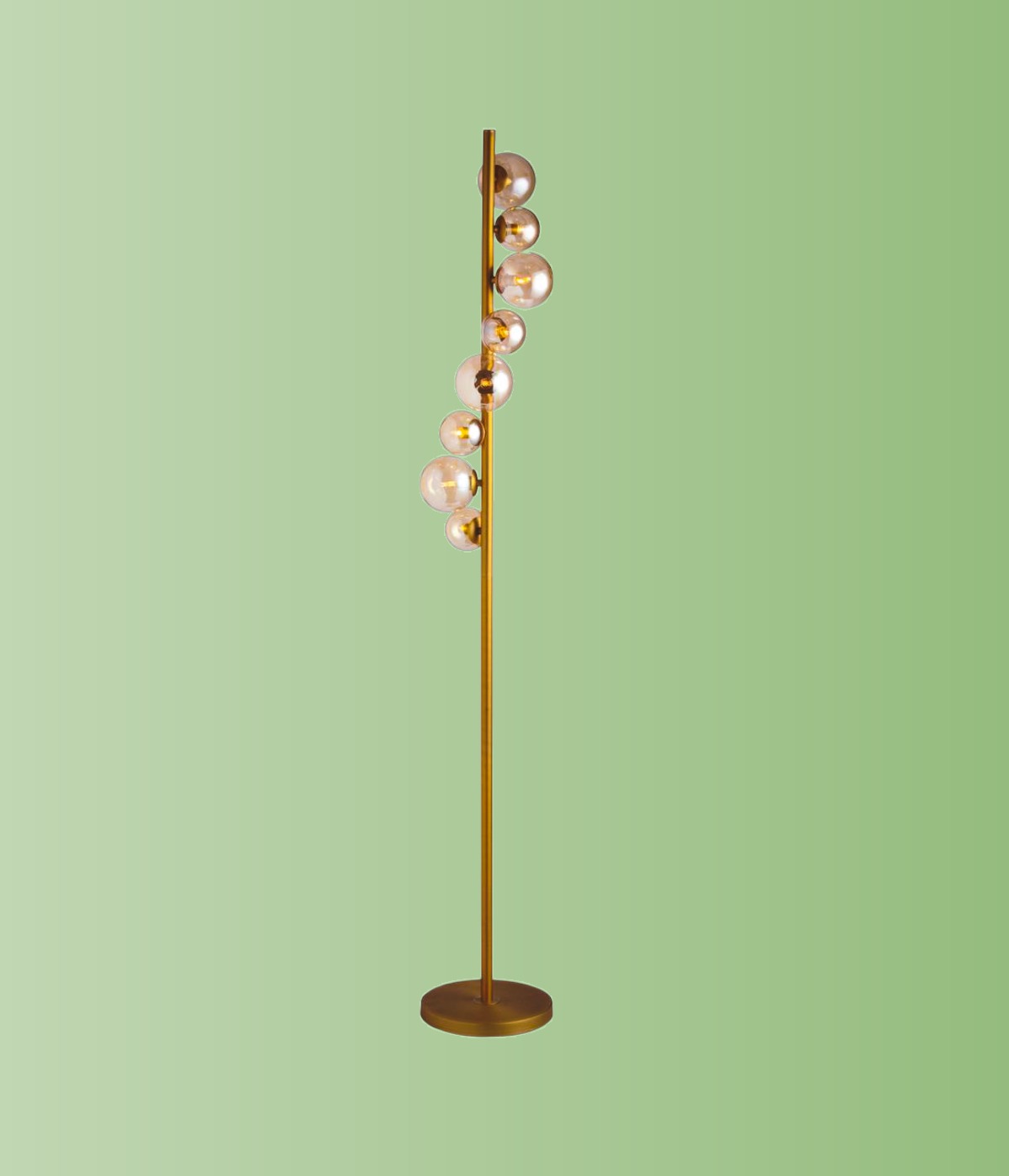 Gold linear floor lamp with champagne glass globes on a soft green background